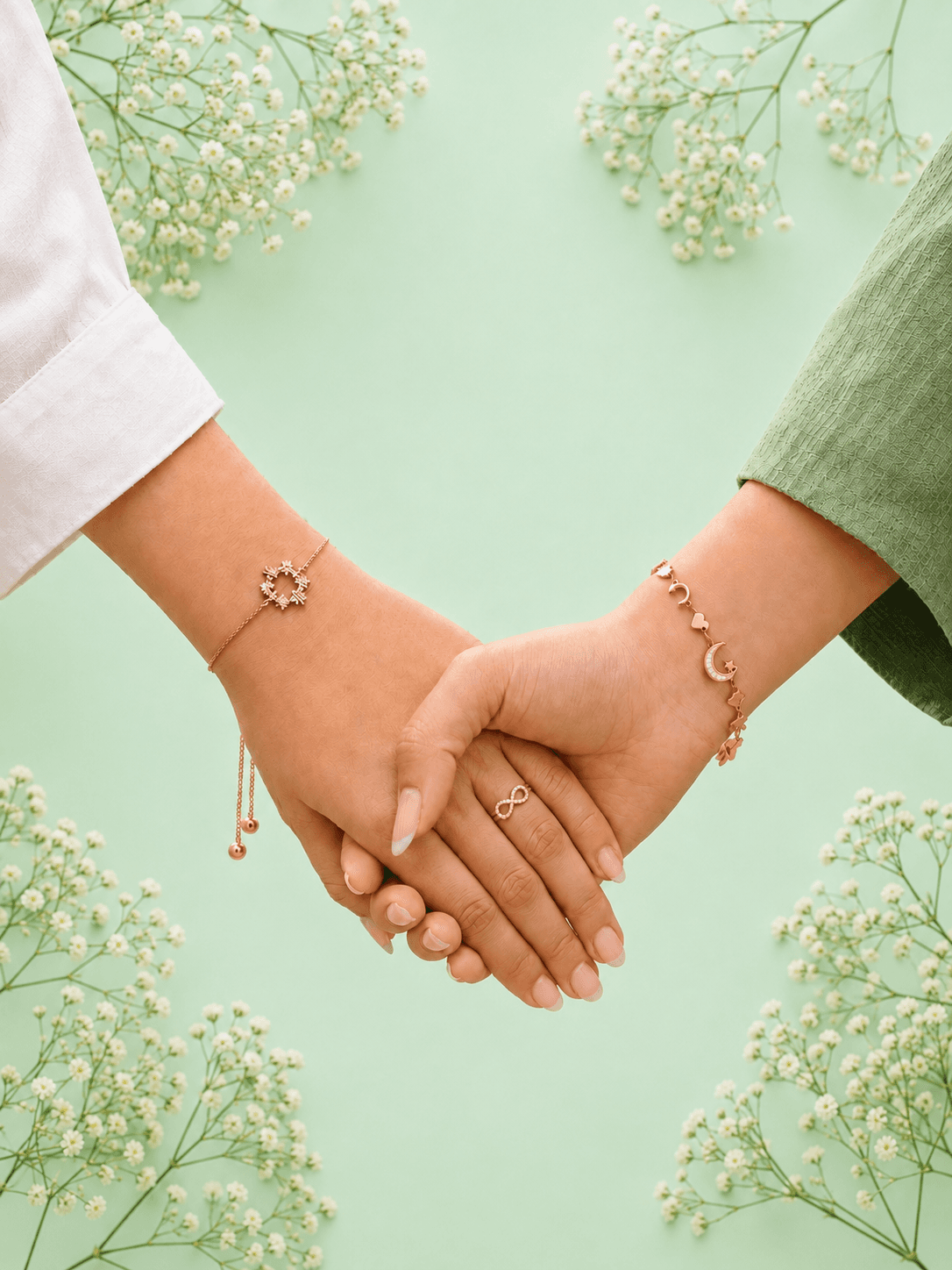 Two sisters wearing SOIS sterling silver jewellery, holding hands